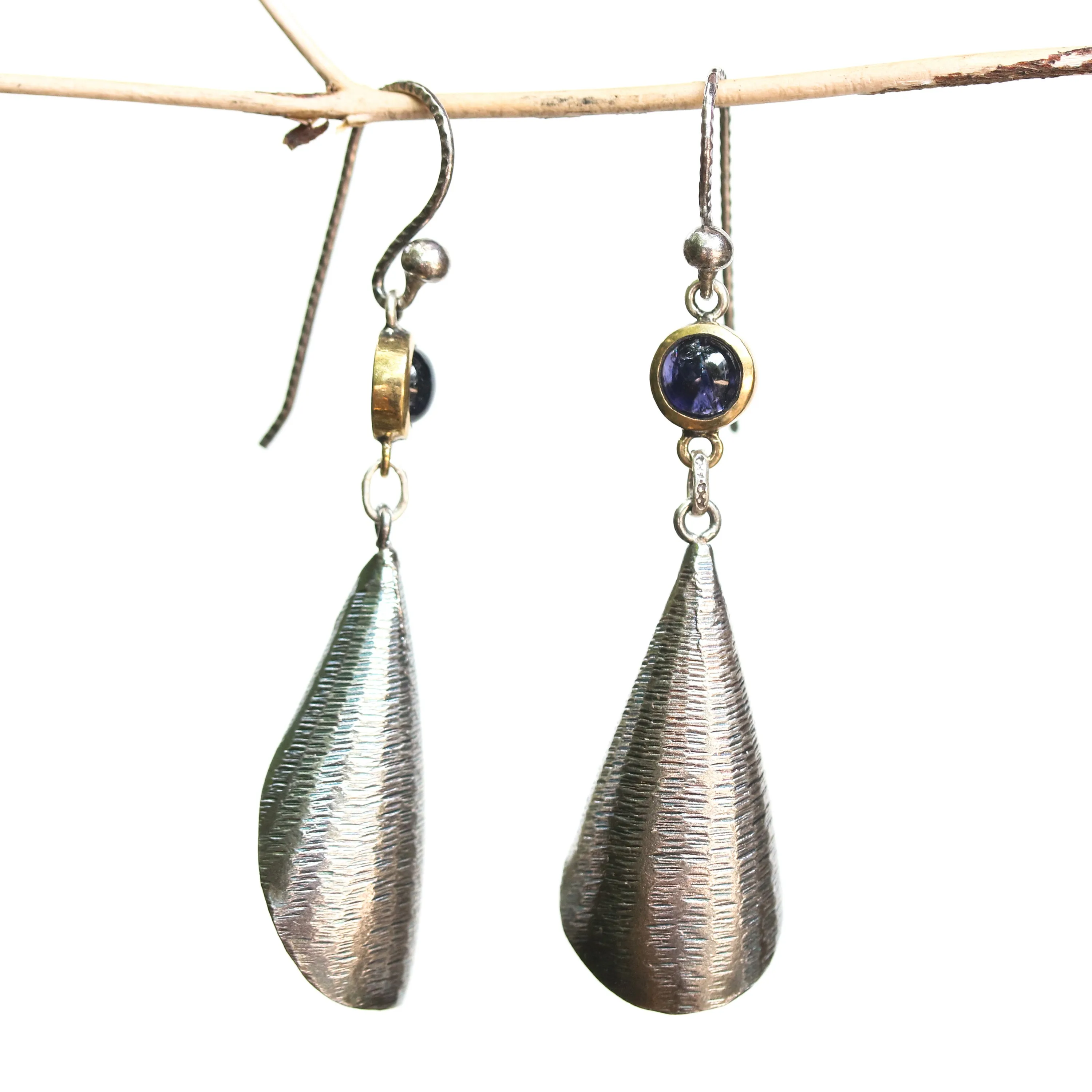 Silver leaf shape earrings with textured and tiny Iolite in brass bezel setting on oxidized sterling silver hooks style