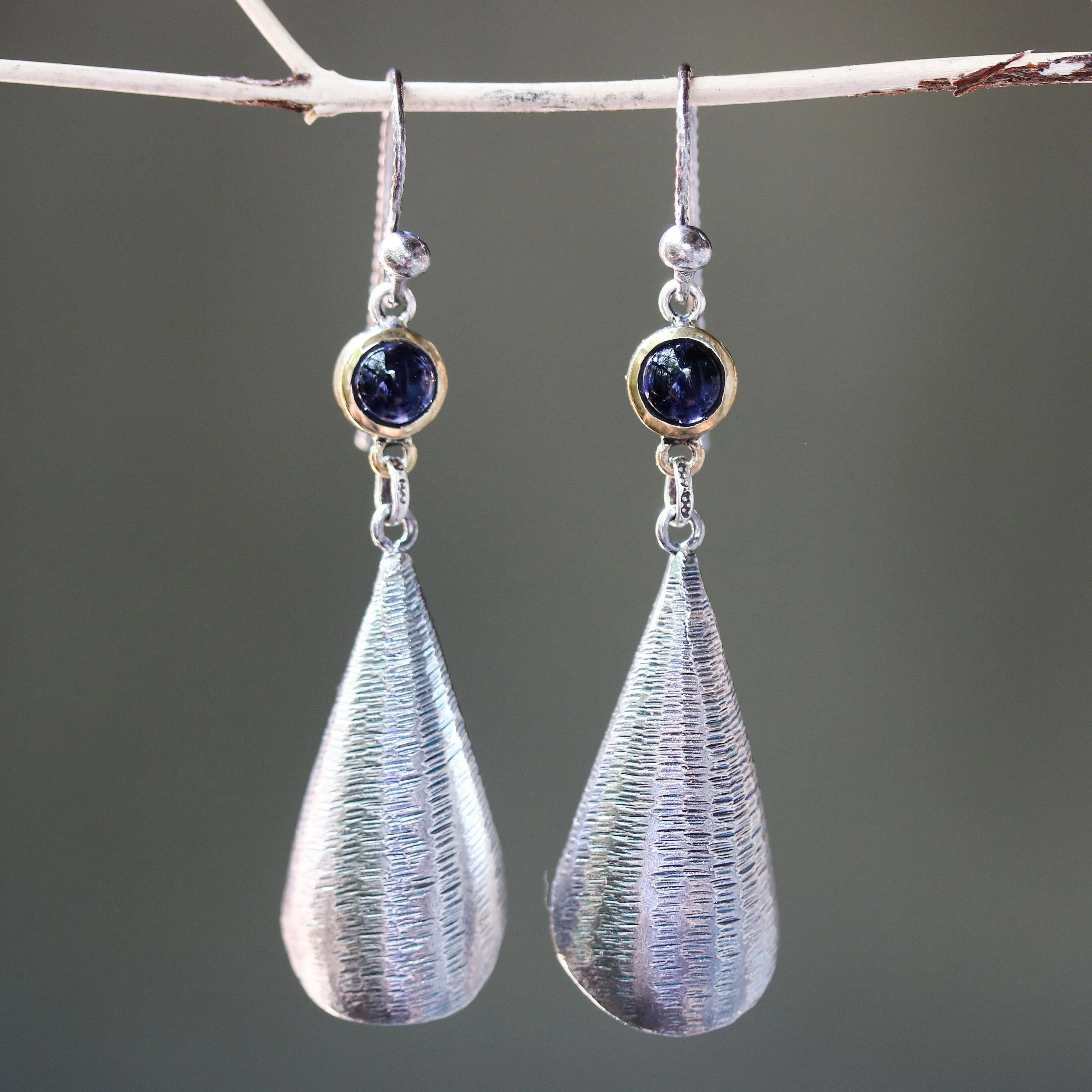 Silver leaf shape earrings with textured and tiny Iolite in brass bezel setting on oxidized sterling silver hooks style