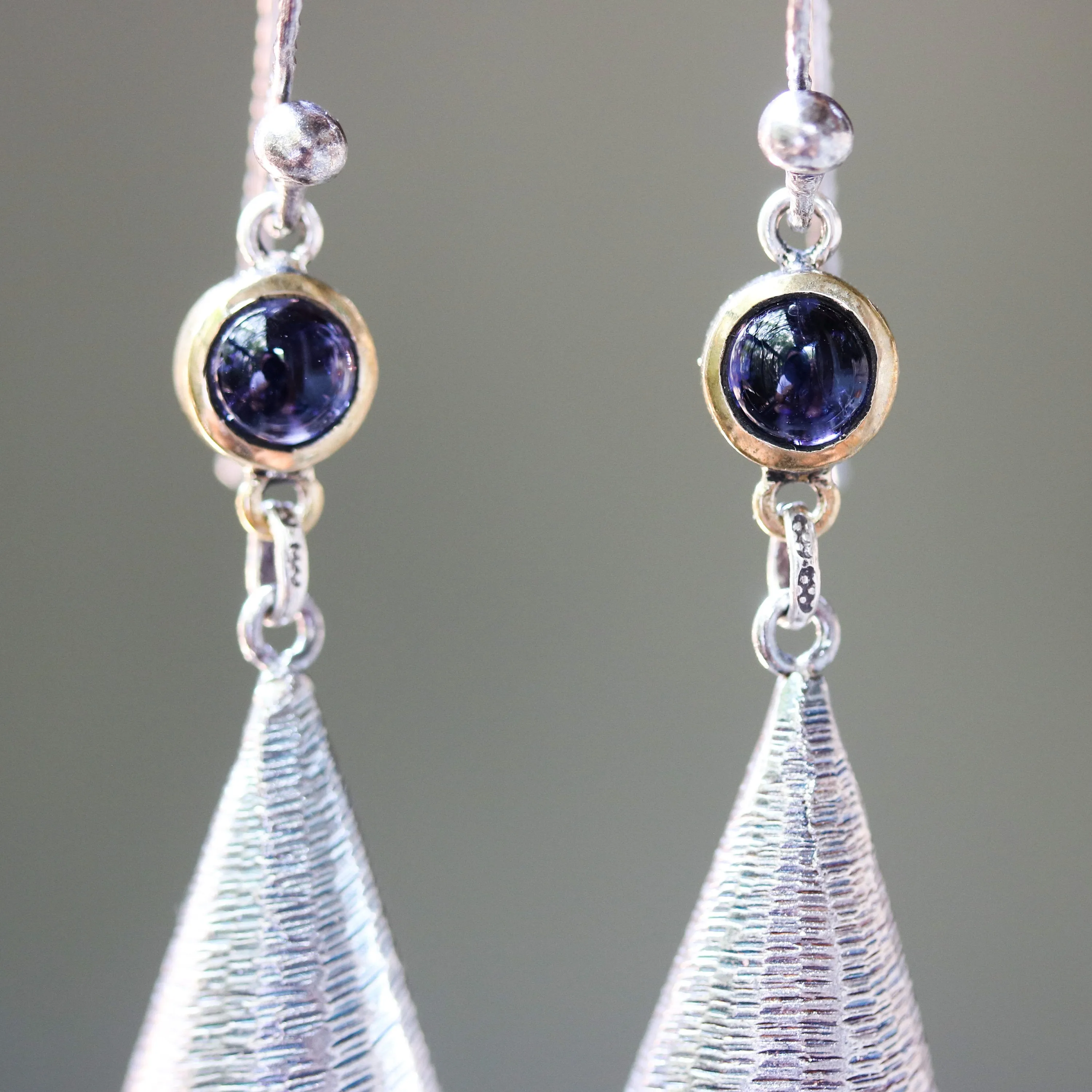 Silver leaf shape earrings with textured and tiny Iolite in brass bezel setting on oxidized sterling silver hooks style