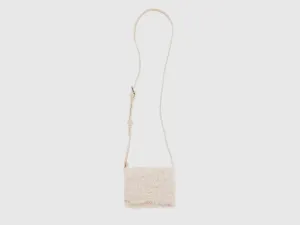 Textured Sling Bag with Spacious Interior and Secure Buckle Closure
